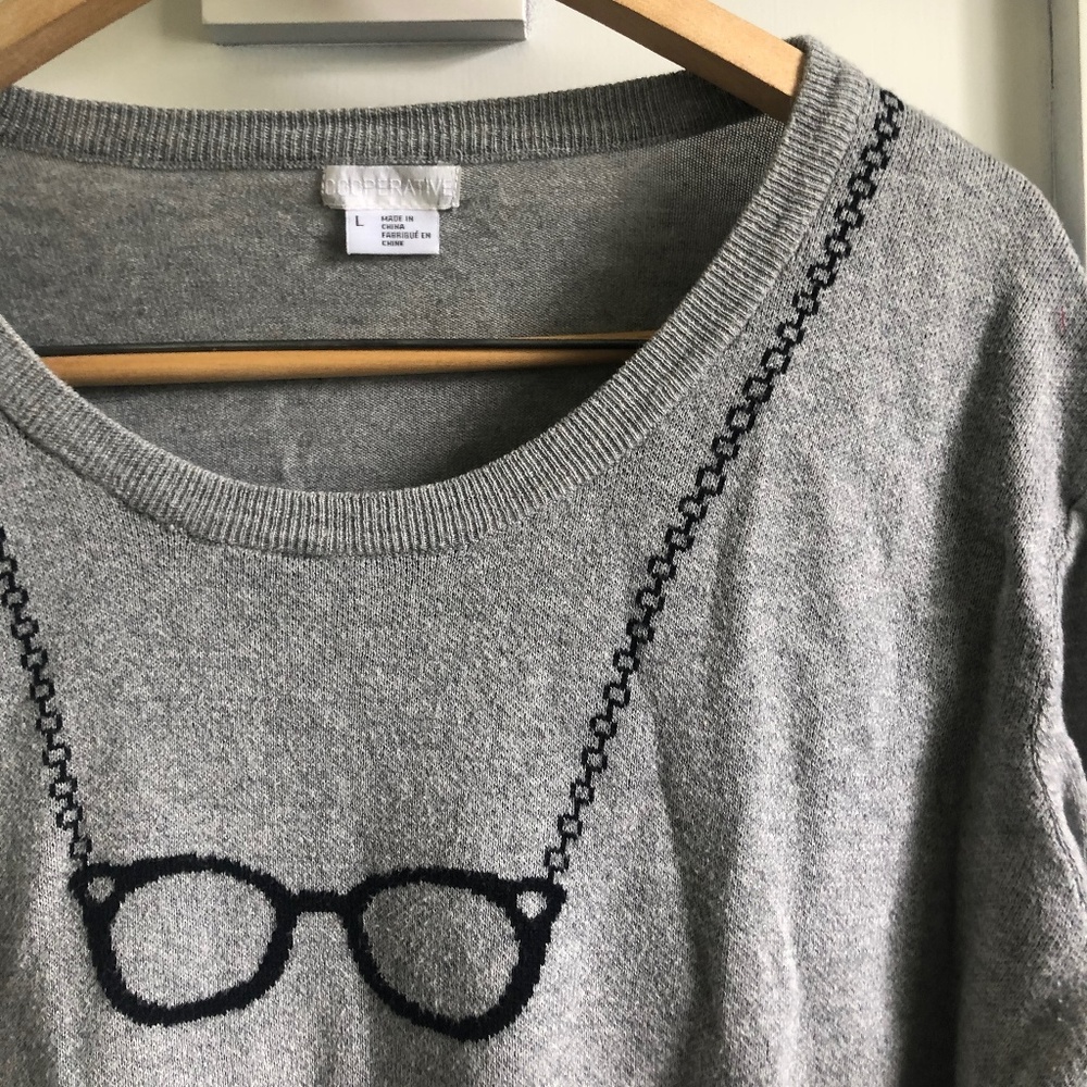 cooperative sweater with eyeglass graphic